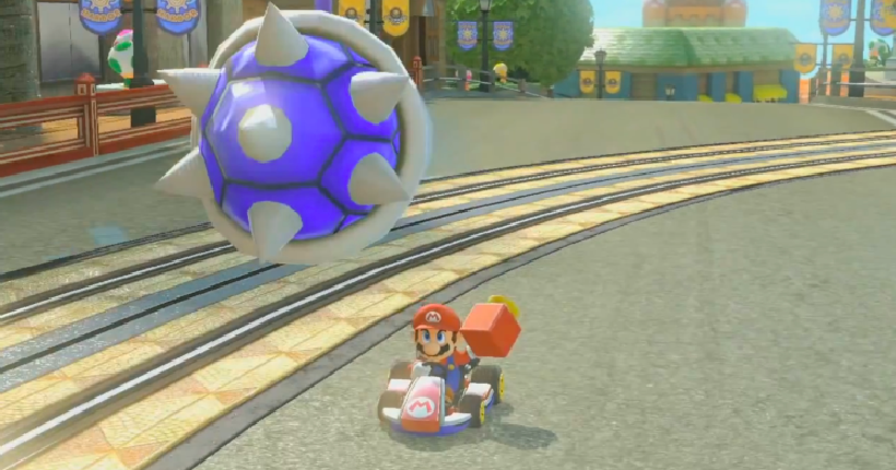 Blue Spiny Shell targeting Mario in an authentic Mario Kart 8 gameplay scene